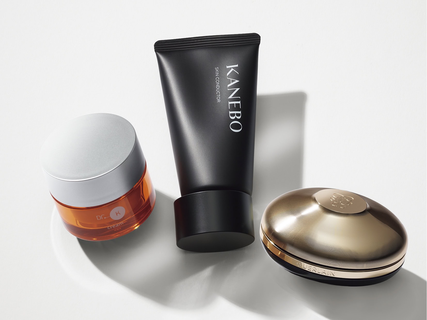 右からGUERLAIN オーキデ アンペリアル ザ ロンジェビティ ライトクリーム、KANEBO スキン コンダクター、Dr.K 薬用ABC-G プレミアムクリームTA