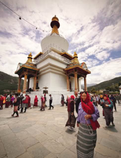 A quiet circle of prayer around the chorten. National Memorial Chorten, Thimphu.